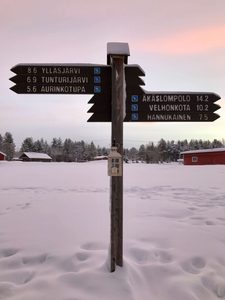 North Pole sign in Lapland surrounded by snow